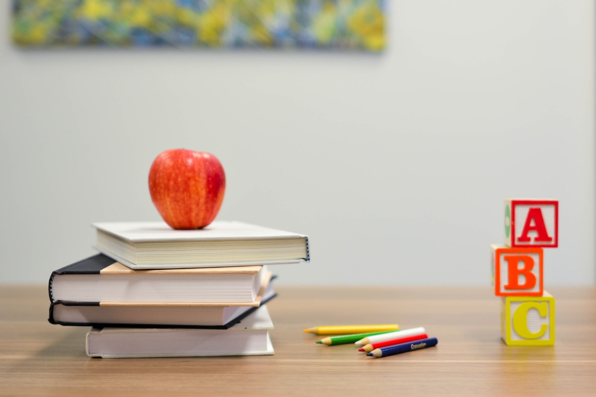 Books building blocks and apple