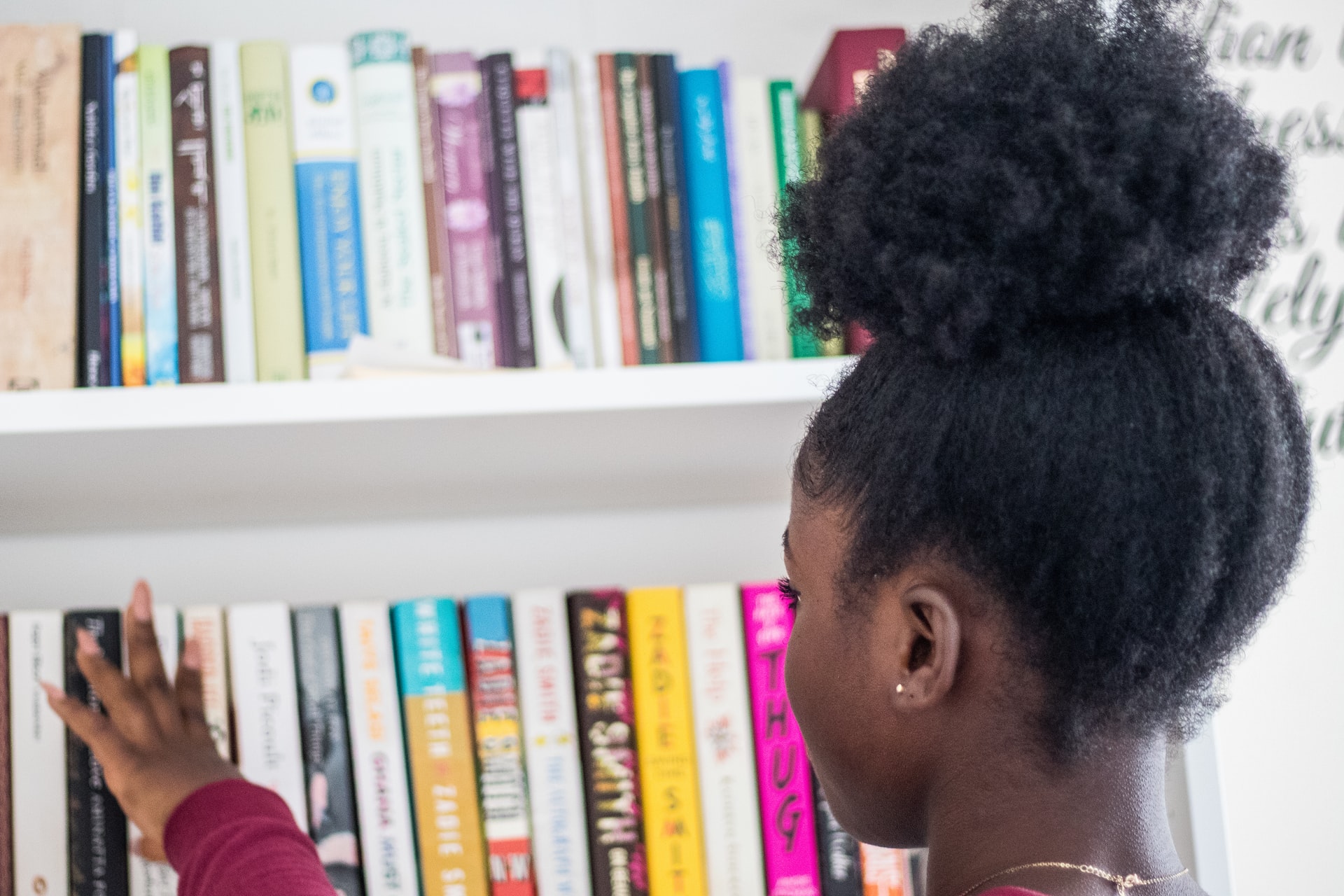 Teacher reading book to kid